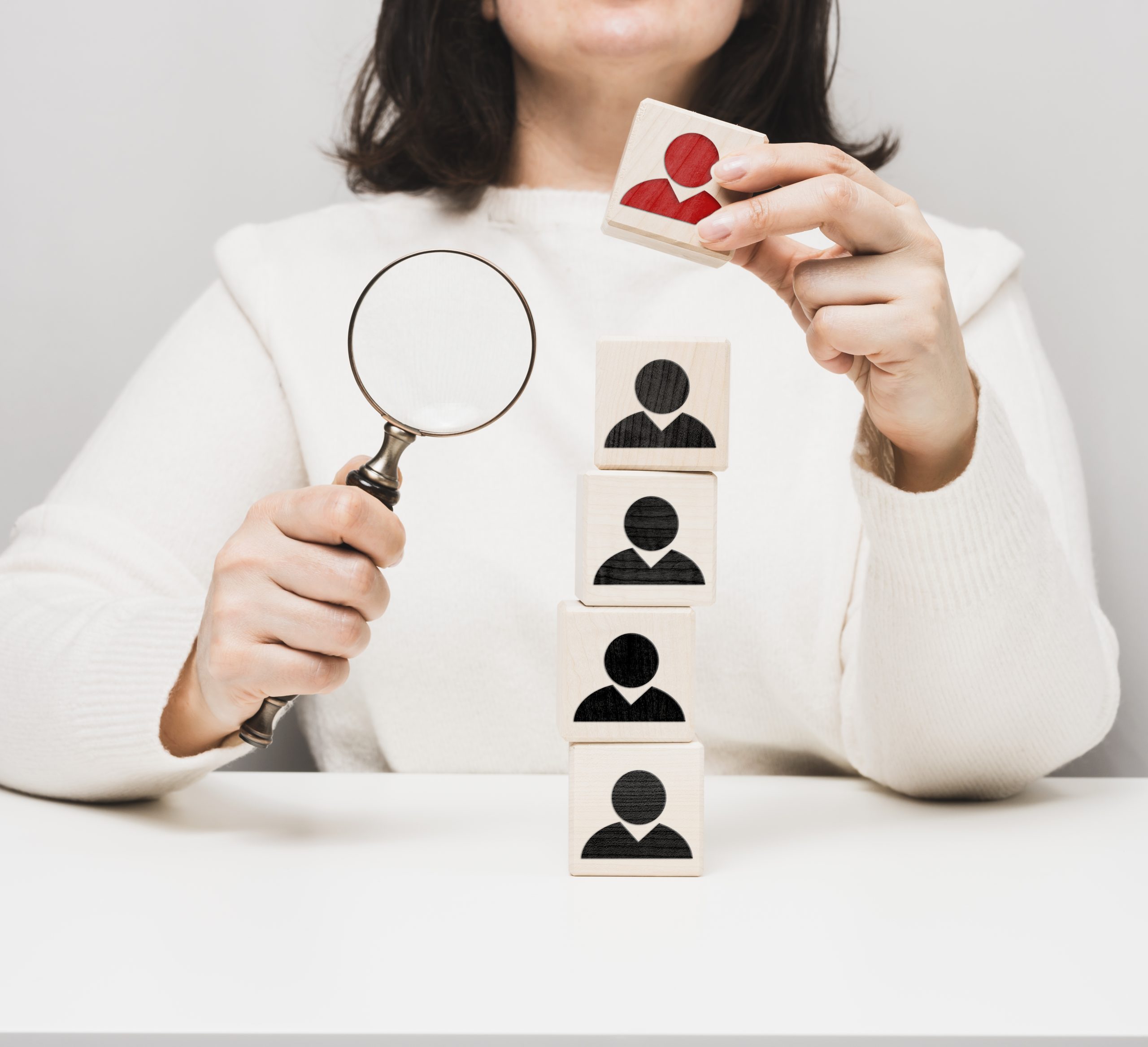 woman holding a magnifying glass and wooden cubes 2025 03 24 05 45 16 utc scaled HR Audit
